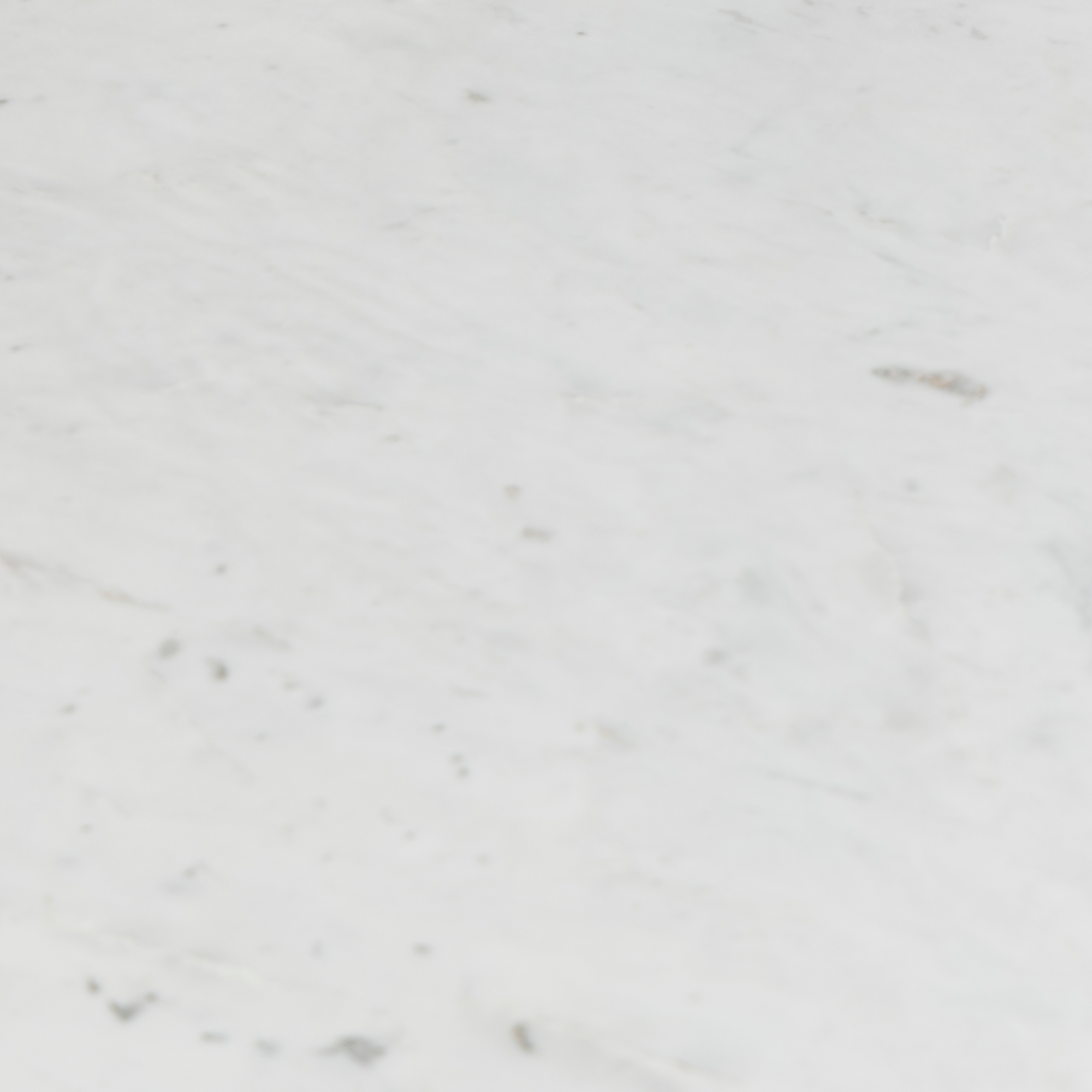 Texture close-up of white marble table top with soft gray veining