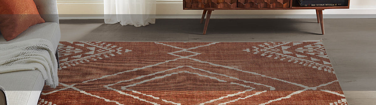 Rust geometric ReaLife rug styled in a modern living room