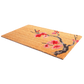 Angled view of non-slip natural coir doormat with red and pink cherry blossom branch