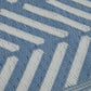 Texture close-up of light blue and white chevron foldable outdoor rug woven chevron stripes