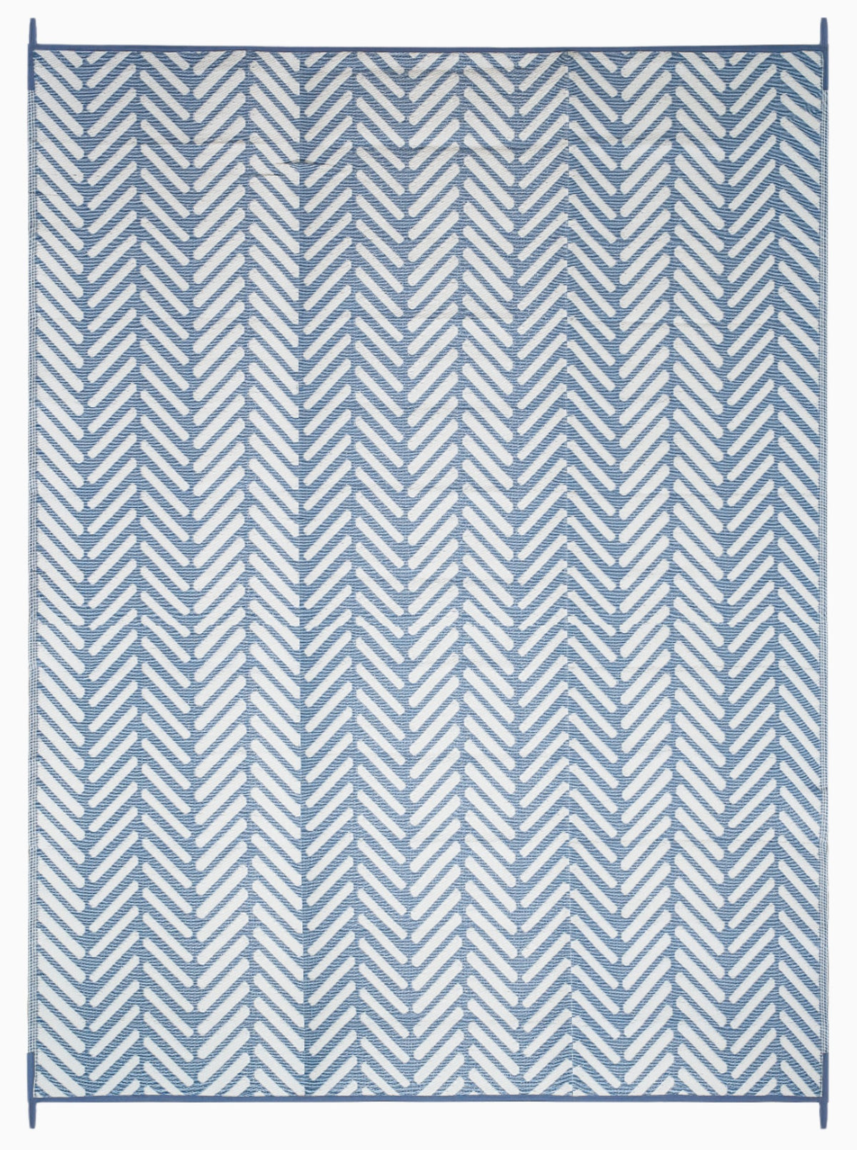 Full view of light blue and white chevron foldable outdoor rug with loops at each corner