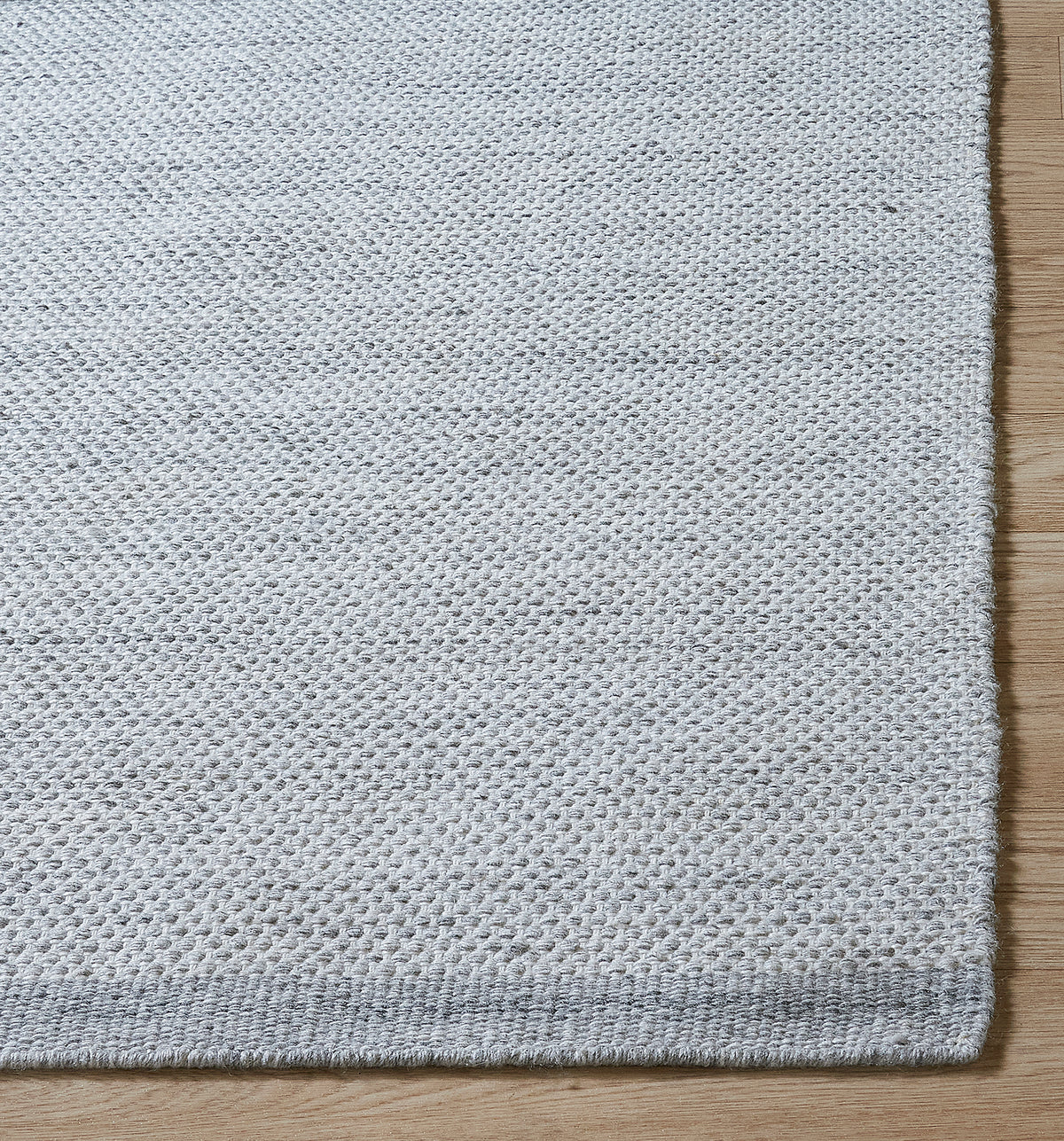 Black & Beige Outdoor Rug, close-up of weave texture, Gray tones