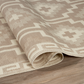 Texture close-up of mocha diamond outdoor rug with rolled edge