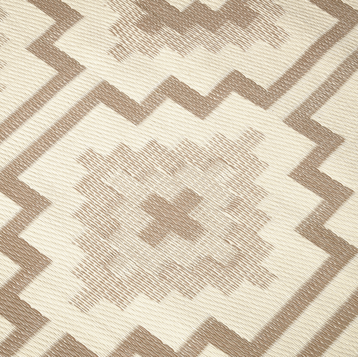 Texture close-up of mocha diamond outdoor rug reverse side weave