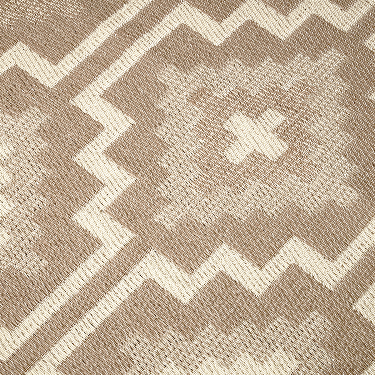 Texture close-up of mocha diamond outdoor rug showing woven diamond motif