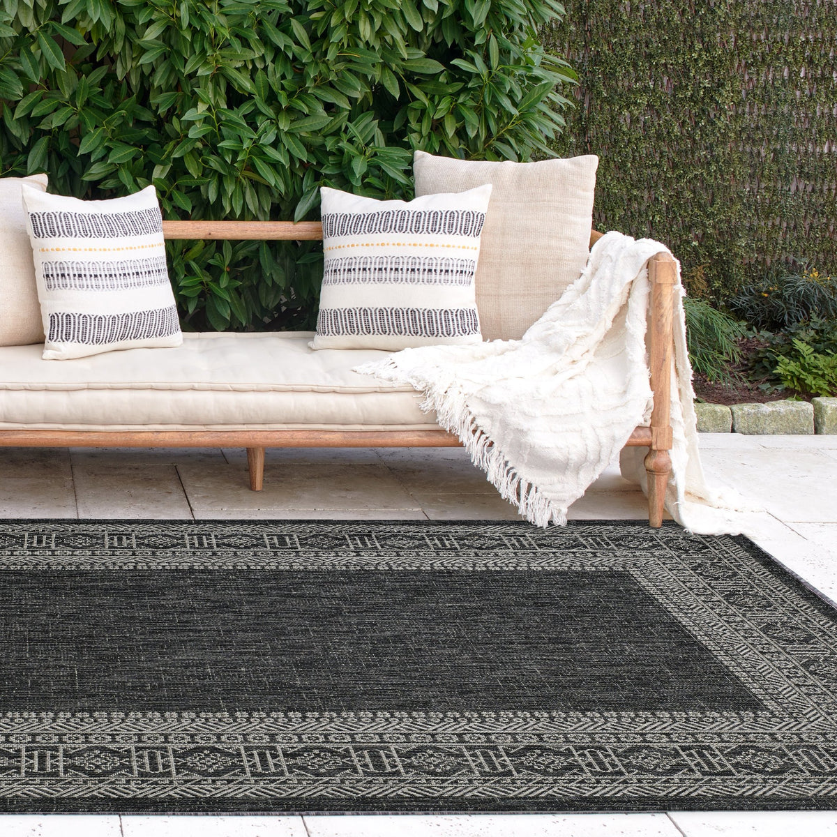 Charcoal Outdoor Rug, lifestyle patio scene, Charcoal tones
