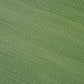Texture close-up of green ombre outdoor rug showing fine woven strands
