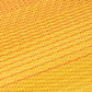 Texture close-up of sunset ombre outdoor rug showing golden yellow strands