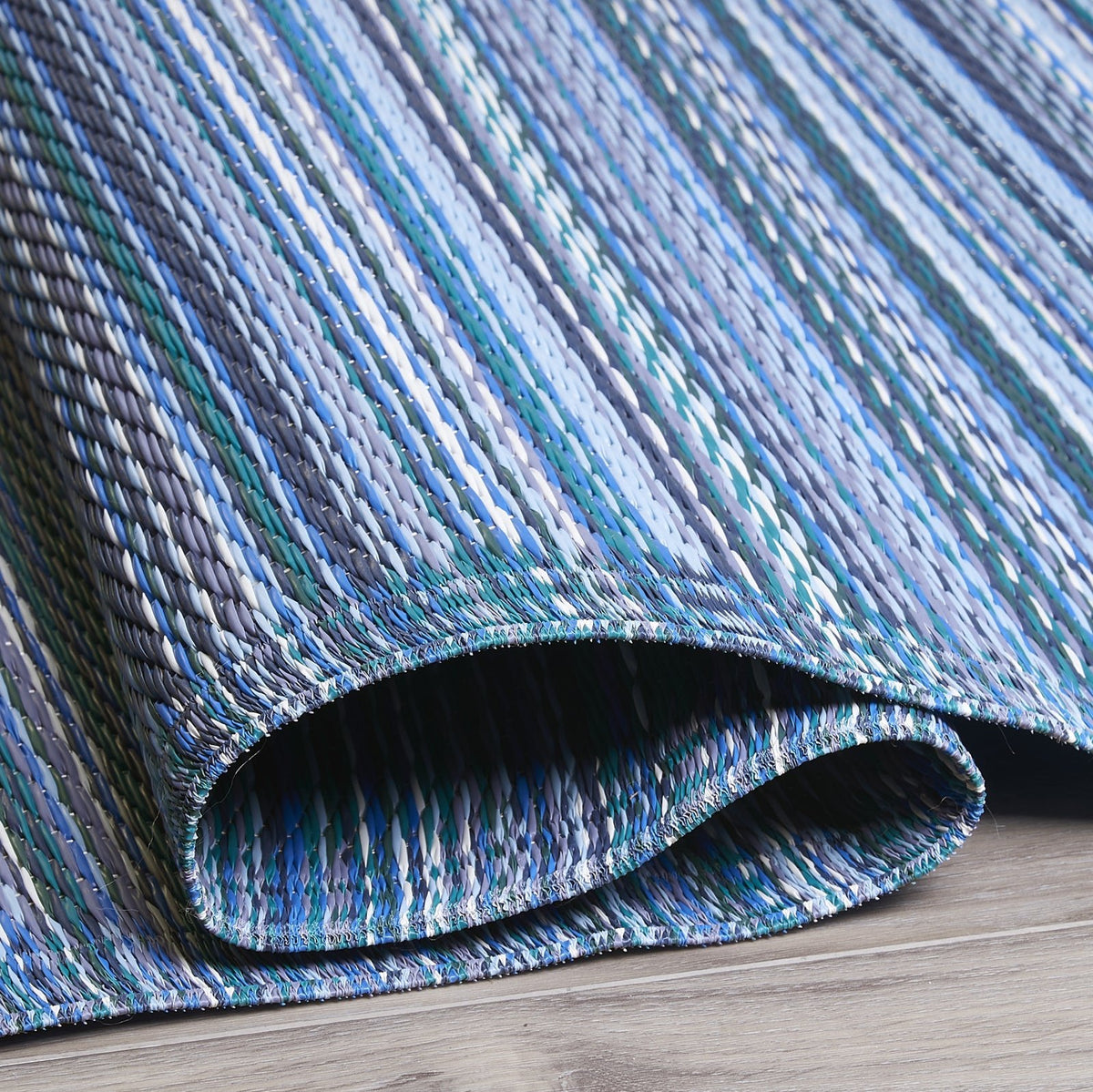Turquoise Outdoor Rug, close-up of pile texture, Indigo tones
