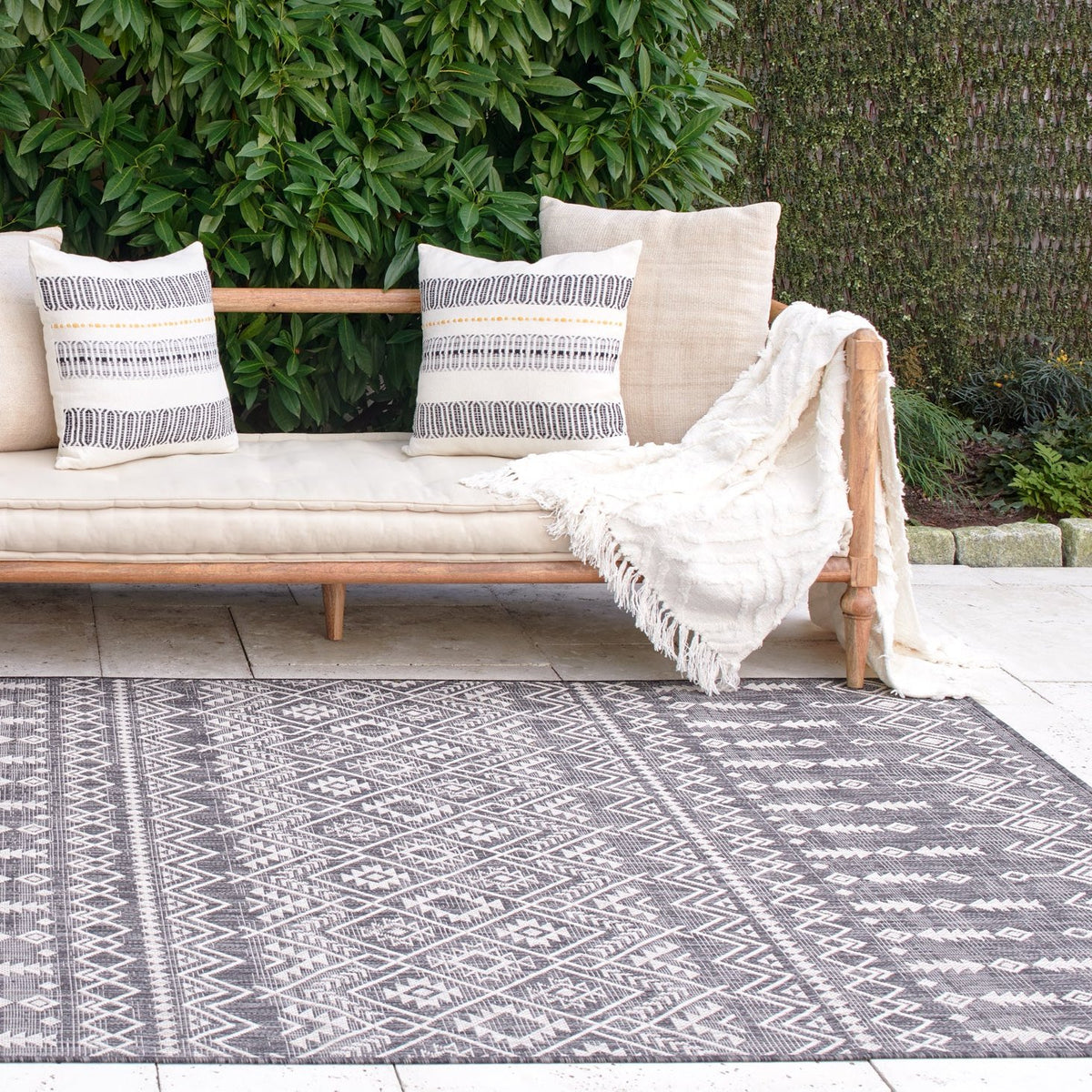 Charcoal Outdoor Rug, lifestyle patio scene, Charcoal tones
