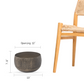Size guide for small antique brass planter by a chair: 12 in opening, 7.8 in high, 13 in wide