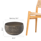 Size guide for large antique brass planter by a chair: 18.5 in opening, 10.5 in high, 19.5 in wide