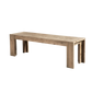 Dune 58 inch solid acacia dining bench in a Weathered Natural finish with a fixed top and wide block legs, angled view