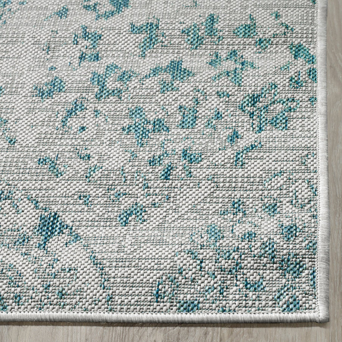 Aqua Outdoor Rug, folded corner showing woven texture