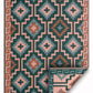Full view of green diamond outdoor rug with corner folded to show coral reverse