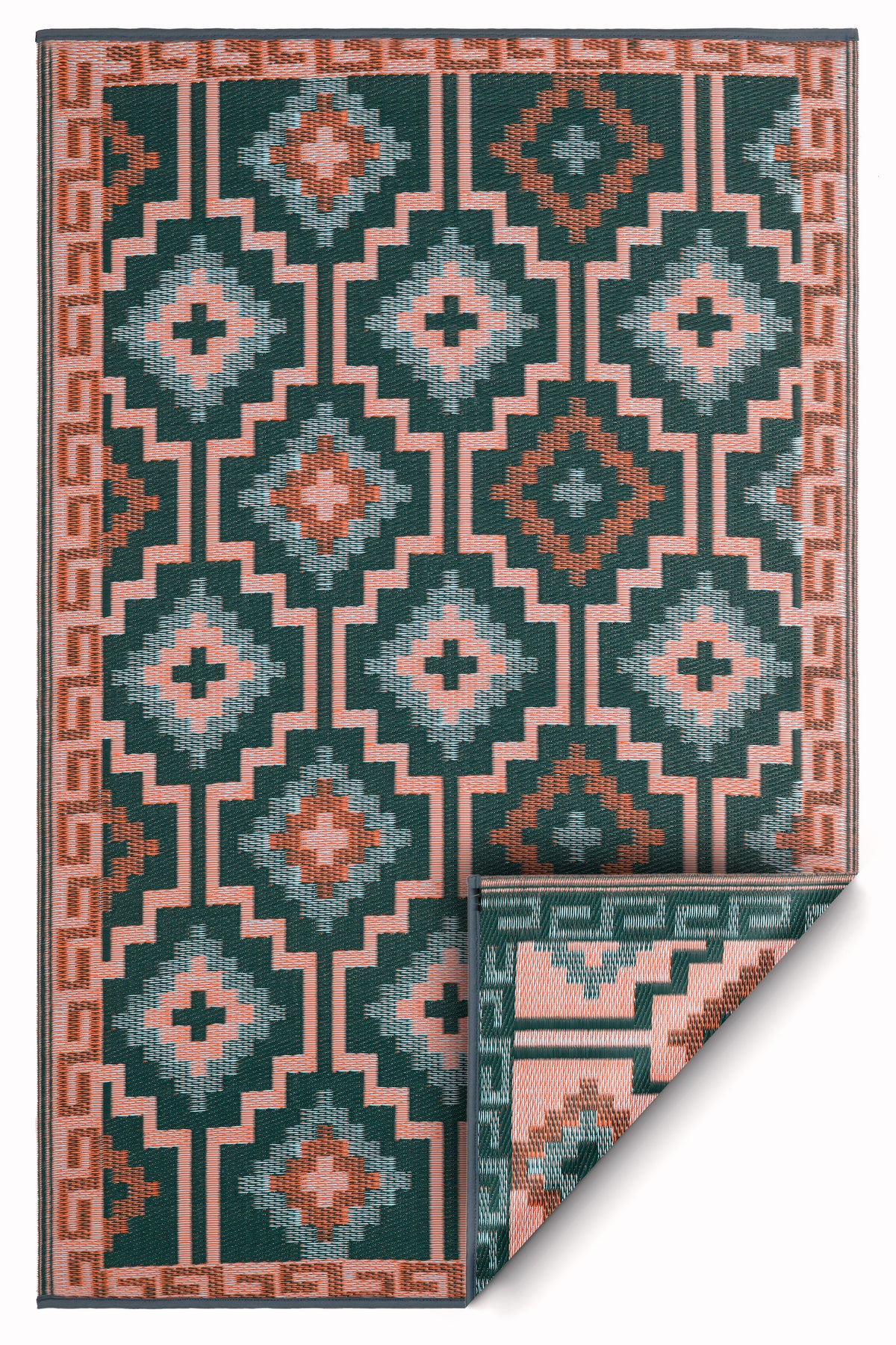 Full view of green diamond outdoor rug with corner folded to show coral reverse