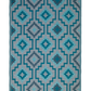 Full view of teal diamond outdoor rug with light gray background