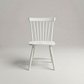 Linnea Soft White Windsor dining chair on a light gray studio background, front view