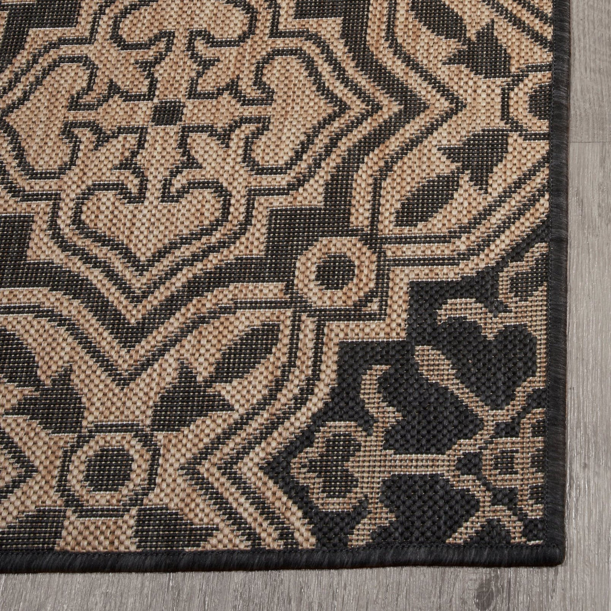 Charcoal Outdoor Rug, folded corner showing woven texture