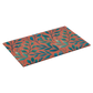 Angled view of peach and teal leaf print doormat