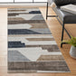 Geometric beige and black rug defining a hallway path in a modern home setting.