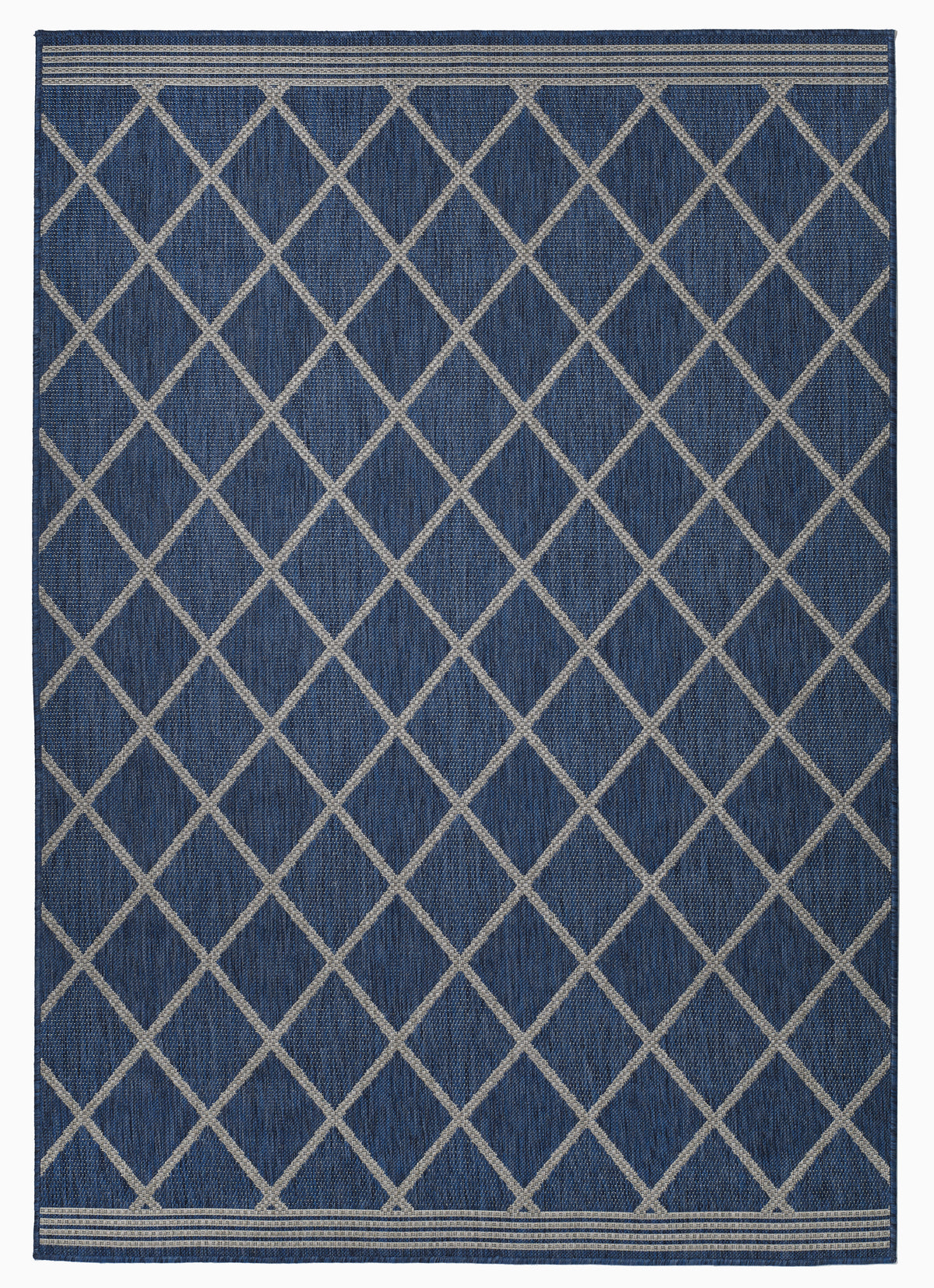 Full view of navy and beige lattice outdoor rug