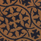 Texture close-up of navy blue tile motif on natural coir doormat
