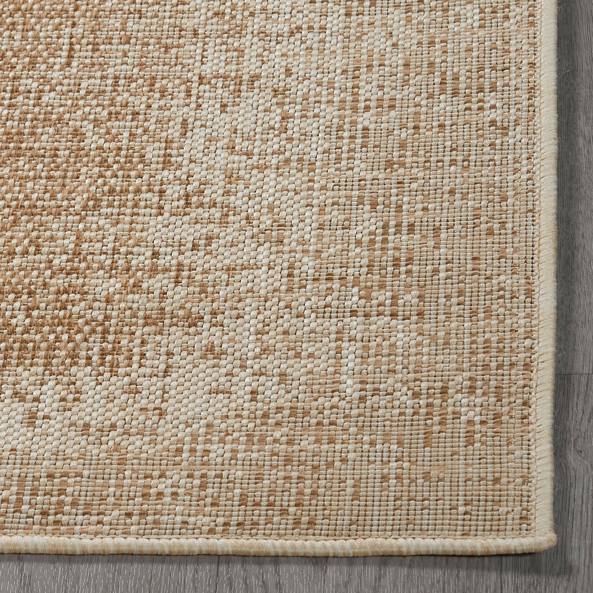 Beige Outdoor Rug, folded corner showing woven texture