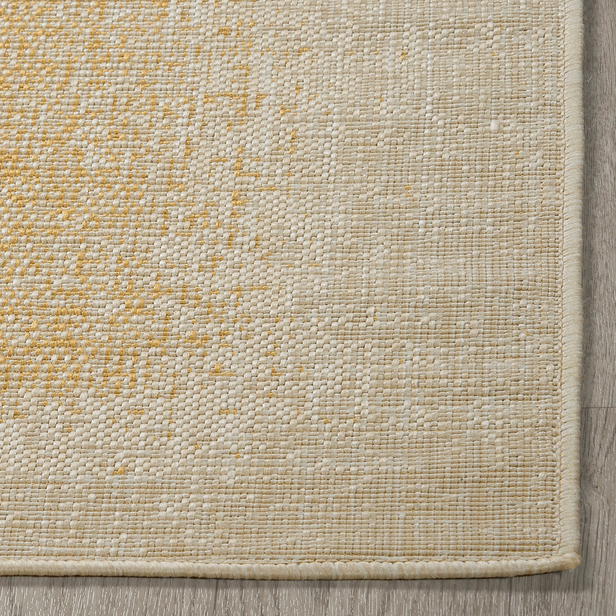 Yellow Outdoor Rug, folded corner showing woven texture