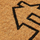Texture close-up of house outline roof line in coir doormat bristles