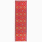 Full view of orange and violet diamond outdoor rug in runner size
