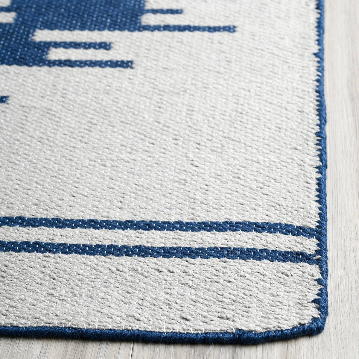 Navy & Gray Aztec Outdoor Rug, close-up of weave texture, Navy tones