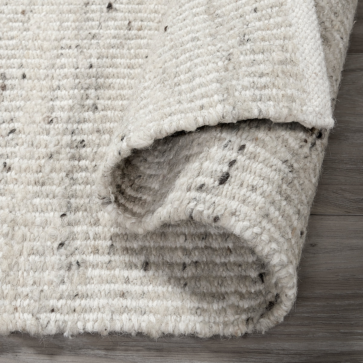 Ivory Area Rug, folded corner detail