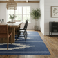 Navy & Gray Aztec Outdoor Rug, lifestyle video of patio seating, alternate angle
